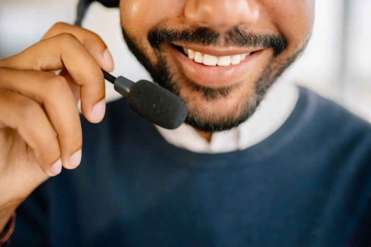 A cheerful customer service agent wearing a headset